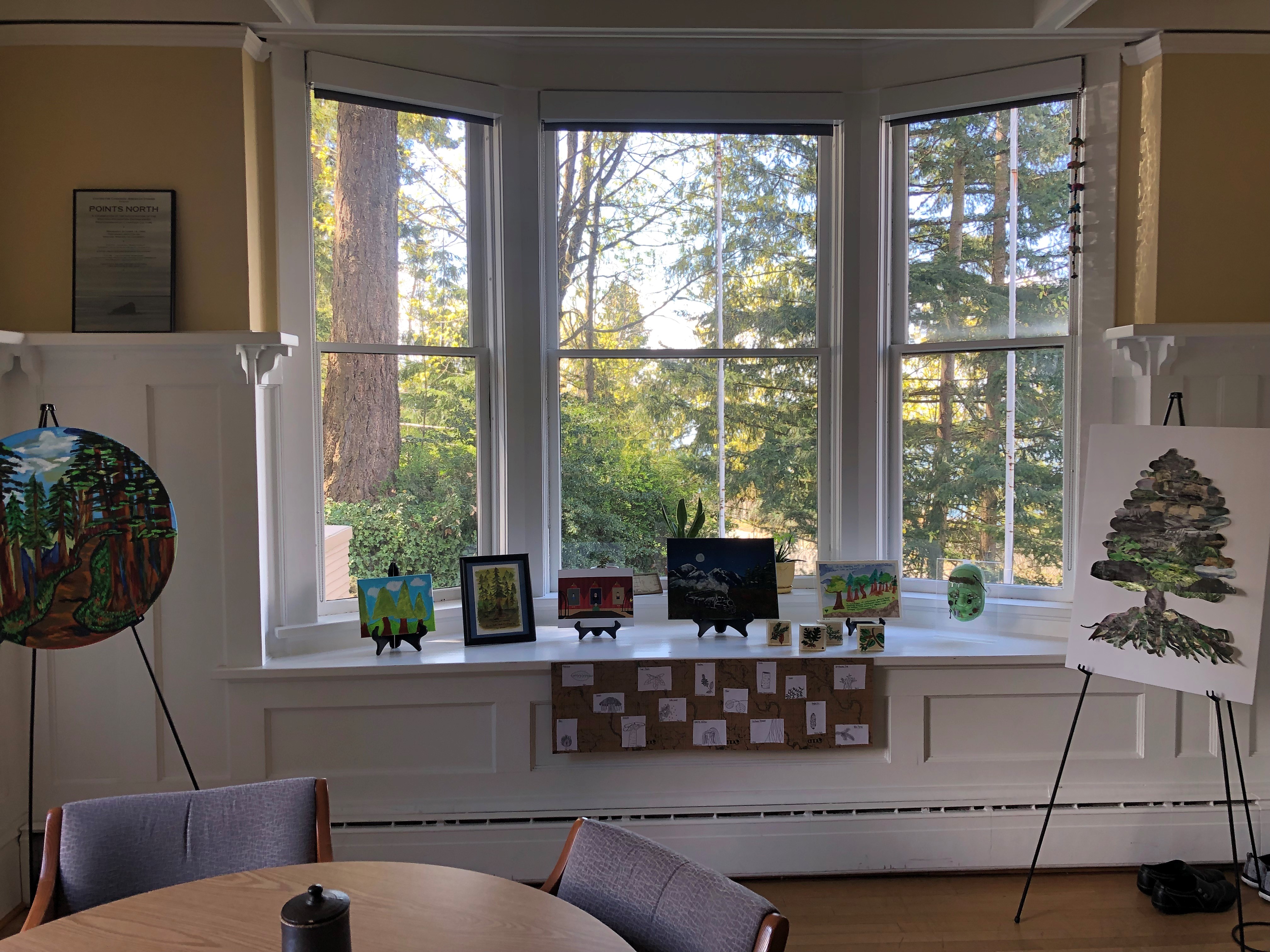 art canvases in front of picture window